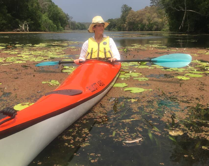 OBSERVING: State MP Kate Washington uses a kayak to see the changes to the river. Pictures: Scott Bevan