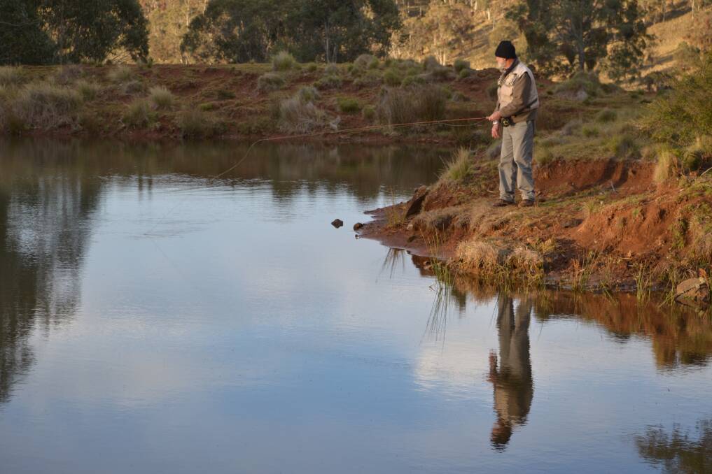 ESCAPE: Barry Brown fly fishing at Stock Dam on Wondecla farm at Hunter Springs in Barrington Tops. Picture: Scott Bevan