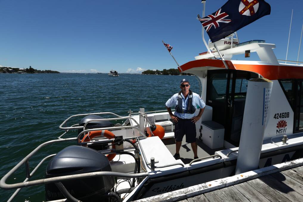 PATROL: NSW Maritime boating safety officer Chris Austen on the shores of Lake Macquarie. Pictures; Jonathan Carroll
