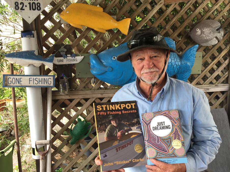Port Stephens author John "Stinker" Clarke with his two latest releases. Picture: Scott Bevan
