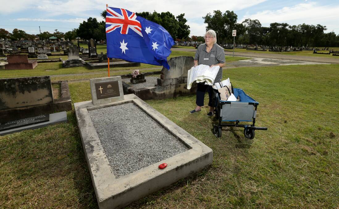 ON THE TRAIL: Local history researcher Cheryle Shoesmith studies her map at the grave of "Lost Digger" George Hodge. Pictures: Jonathan Carroll