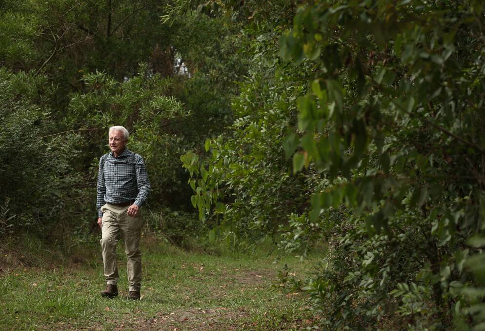 Brian Gilligan walking through Awabakal Nature Reserve at Dudley. Picture: Simone De Peak