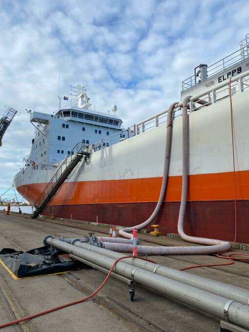 Orange juice concentrate being piped out of a ship in Newcastle harbour. Picture: Courtesy, Marcos de Oliveira 