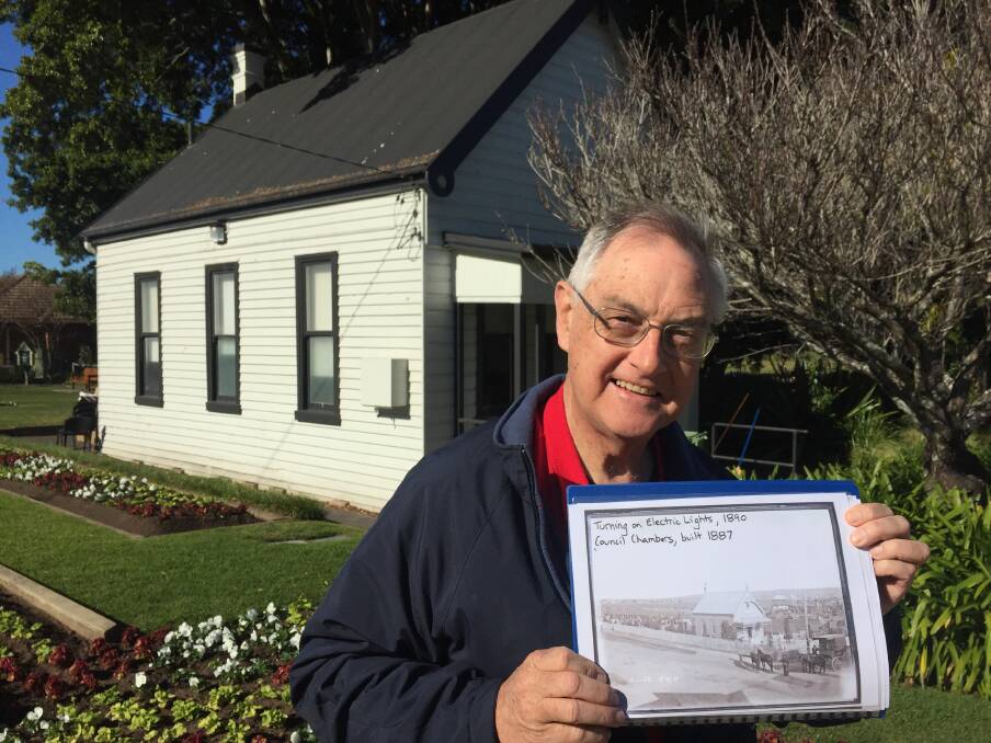 Community historian Robert Watson holds a historic photo of the council chambers outside the building in Lambton Park. Picture: Scott Bevan 