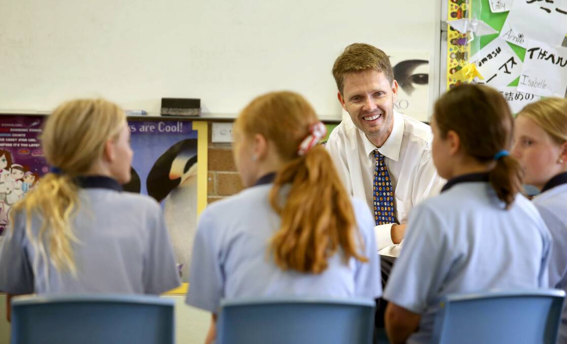 Craig Eardley, teaching an ethics class at Merewether Public School. The demand for ethics classes is outstripping the supply of volunteer teachers. Picture: Dean Osland