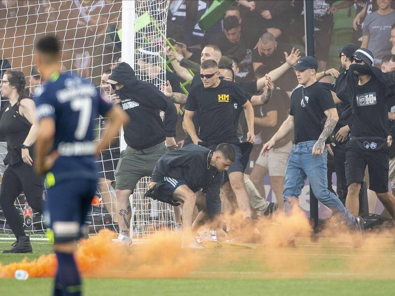 More arrests have been made after Melbourne Victory fans invaded the pitch during an A-League match. (Will Murray/AAP PHOTOS)