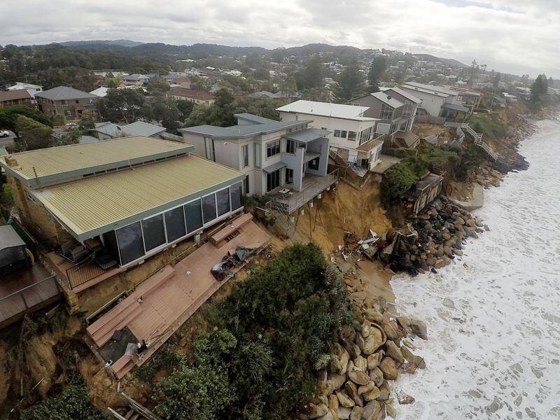 Coastal erosion from storms has left properties on the NSW Central Coast teetering over the ocean.