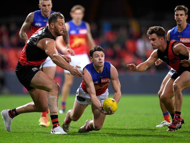 Lachie Neale (c) was outstanding as Brisbane thrashed Essendon by 63 points on the Gold Coast.