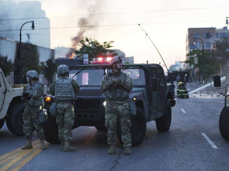 Minnesota Governor Tim Walz says the National Guard was needed as outsiders hijacked protests.
