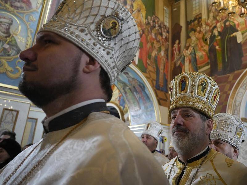 One of Ukraine's iconic cathedrals has marked Christmas after cutting ties with the Russian church. (AP PHOTO)