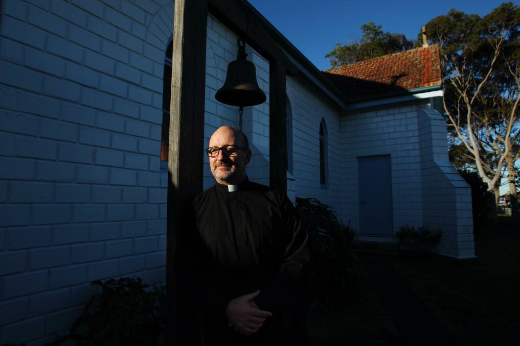 NOISE ZONE: Reverend Bryce Amner outside St Saviours church at Williamtown. Picture: Max Mason-Hubers