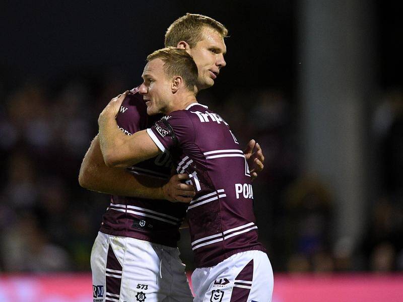 Manly's Tom Trbojevic (left) and Daly Cherry-Evans celebrate following ther win over Canberra.