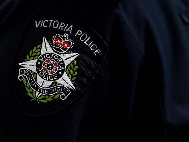 A Victorian police officer filmed appearing to kick a man in the head has been suspended.