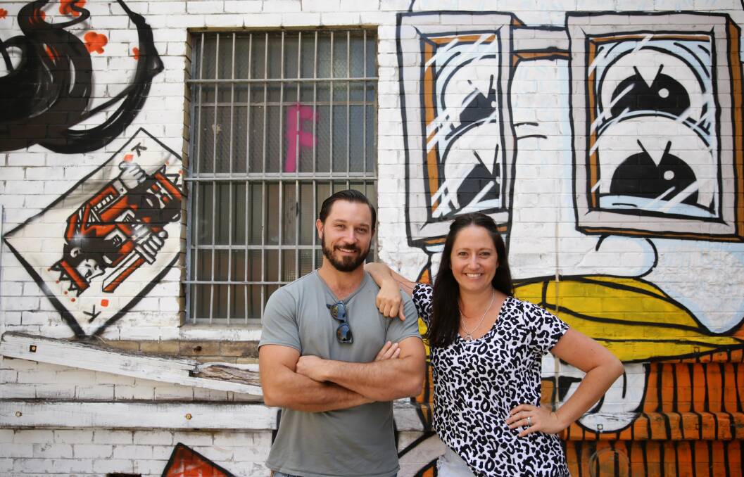 PASSION: Twin Chris Joannou and Louise Kipa share a passion for Newcastle. Picture:Peter Stoop
