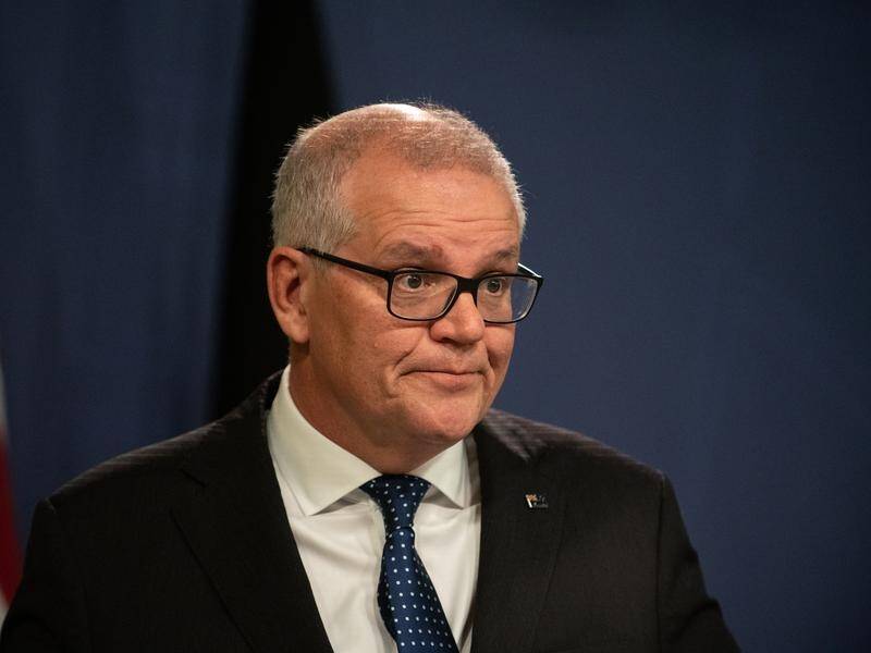Scott Morrison has justified his decision to take on extra portfolios while he was prime minister. (Flavio Brancaleone/AAP PHOTOS)