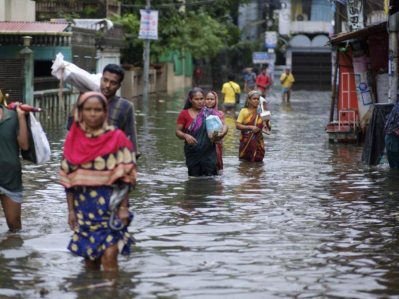At least 36 people have died and about 4.5 million have been stranded by flooding in Bangladesh.