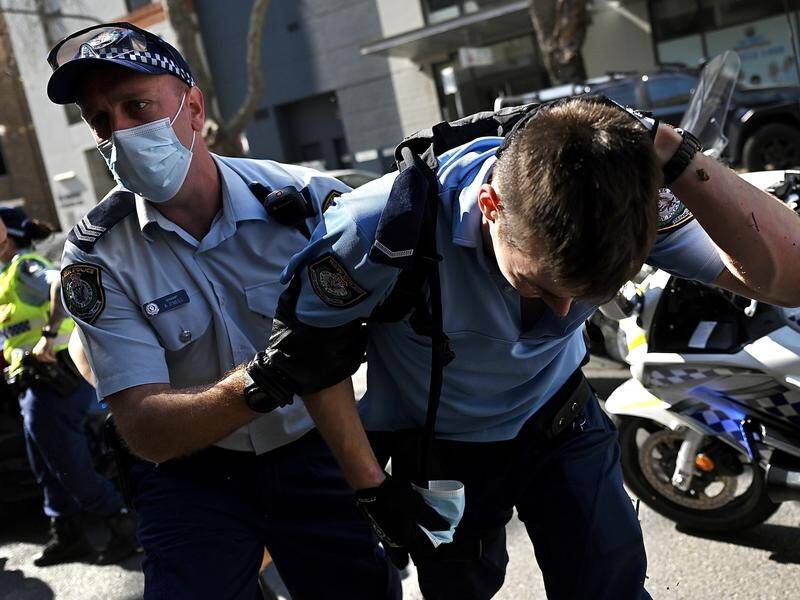 A police officer was taken to hospital with head and neck injuries after the protest in Sydney.