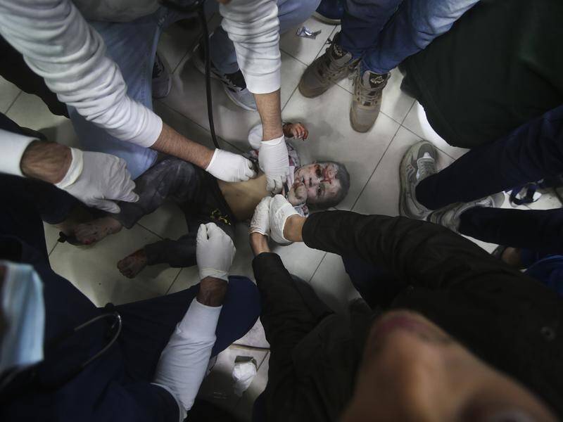 Palestinian medics are operating under heavy fire as two Gaza hospitals are besieged by Israel. (AP PHOTO)