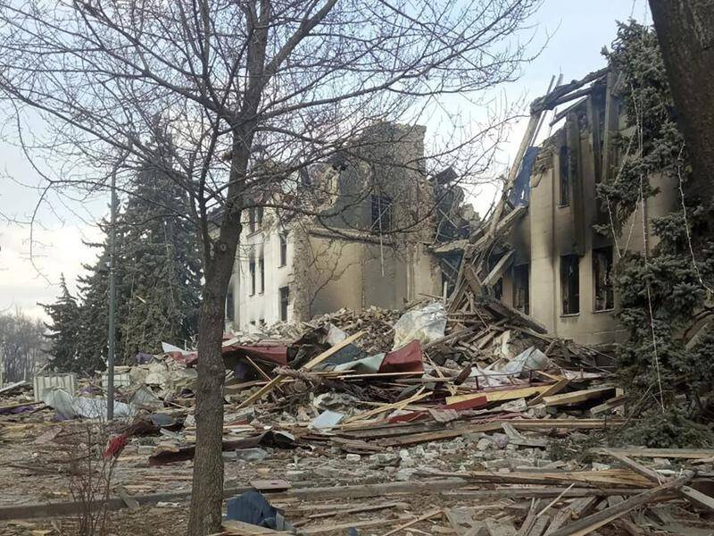 Rescuers were combing the rubble for survivors at the site of a bombed theatre in Mariupol.