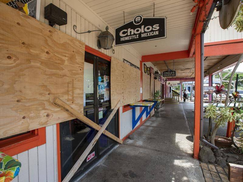 Shops have been boarded up as Hurricane Douglas approaches Hawaii as a Category 1 storm.
