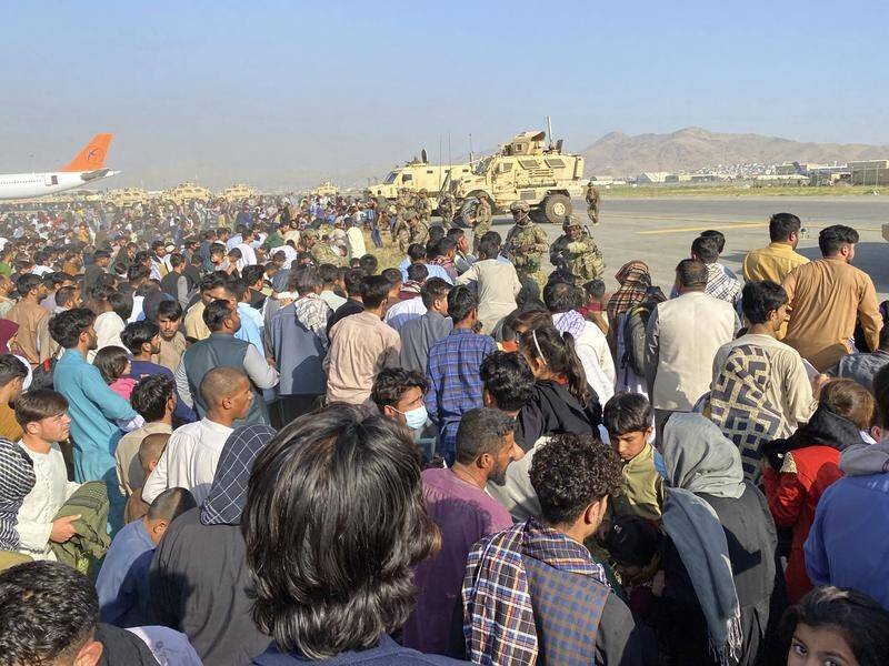 Thousands of Afghans trapped by the sudden Taliban takeover have rushed the tarmac at Kabul airport.