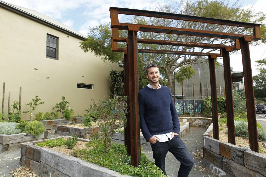 NCH NEWS. Pic shows landscape designer Mark Tisdell who built the community garden on Darby Street using a grant from council. He has working on a new art installation on Darby Street now. Cooks Hill. 13th May 2015. Pic by MAX MASON-HUBERS MMH