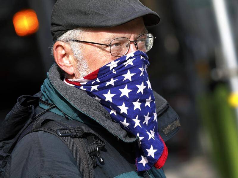 A man wears a face covering resembling the US flag in New York during the coronavirus lockdown.