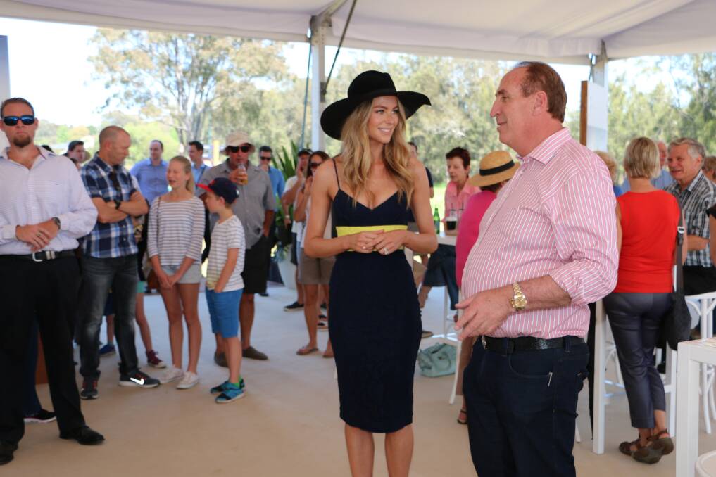 A NATURAL: Jennifer Hawkins with Keith Johnson at the Trinity Point marina open day  on Sunday. Picture: Jamieson Murphy