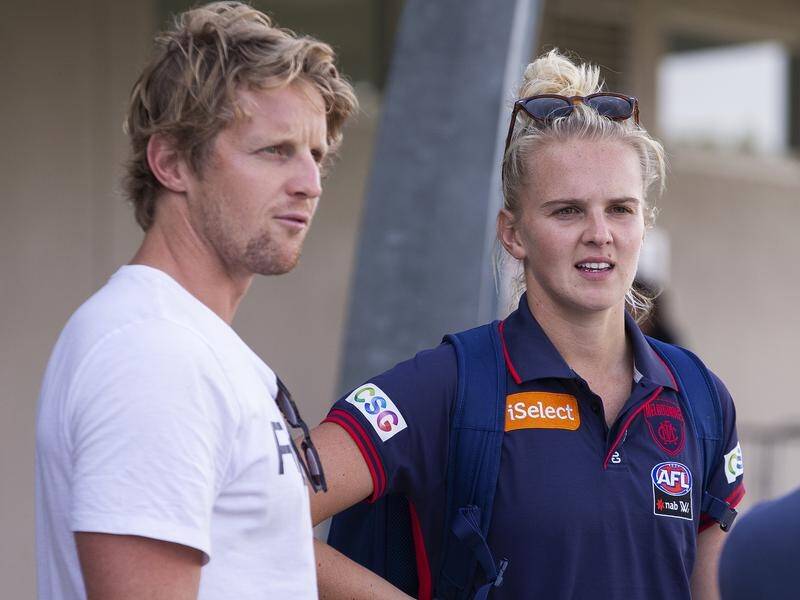 AFLW player Shae Sloane, seen here with brother Rory, has ruptured her ACL for a third time.