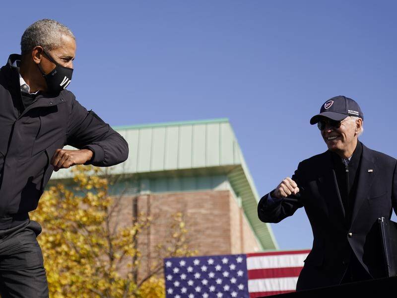 Former US president Barack Obama (left) has congratulated Joe Biden on his election victory.
