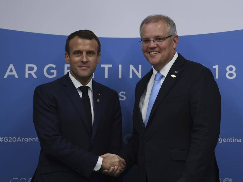 Scott Morrison and Emmanuel Macron(L)will personally deal to resolve Australia's submarine contract.