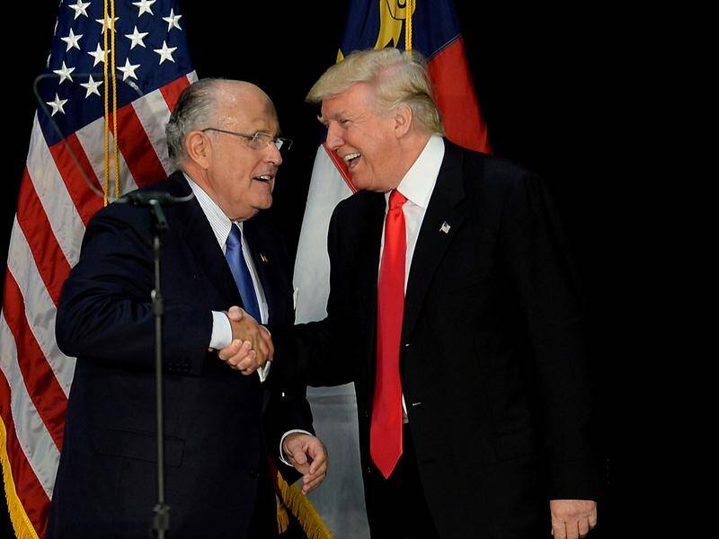 Rudy Giuliani' (L) says Donald Trump's was discussing the Moscow tower throughout 2016.