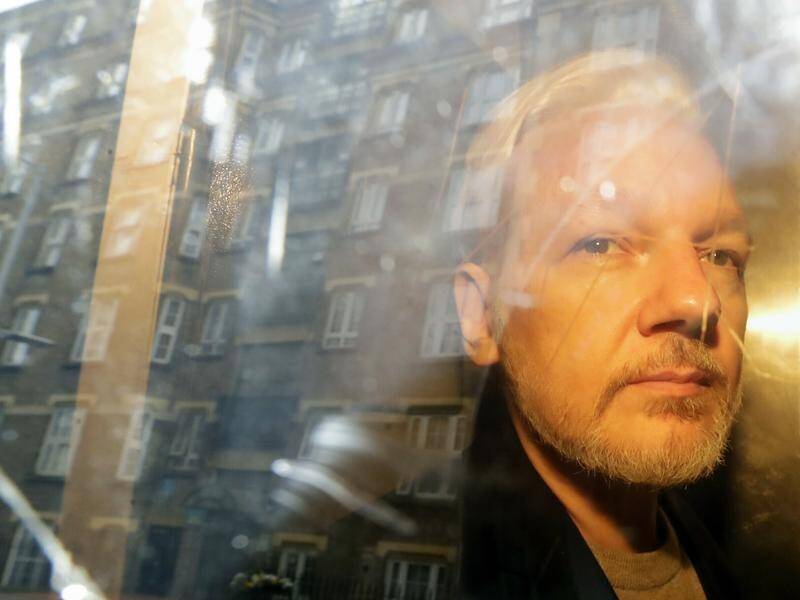 Julian Assange has 'a real prospect' of successfully appealing against his extradition, judges say. (AP PHOTO)
