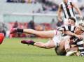 Collingwood will seek clarification from the AFL over a high tackle ruling involving Jack Ginnivan. (Scott Barbour/AAP PHOTOS)