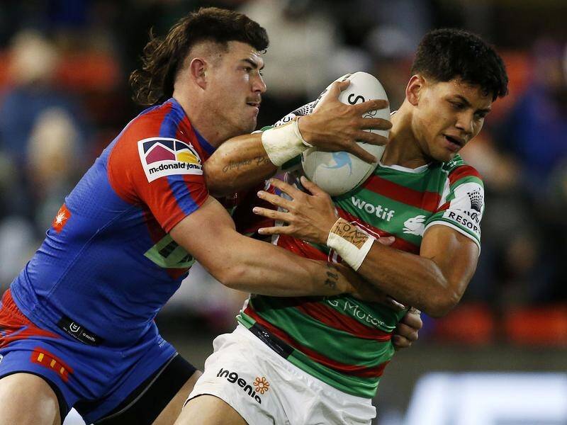 Jaxson Paulo is tackled by Bradman Best during South Sydney's NRL win over Newcastle.