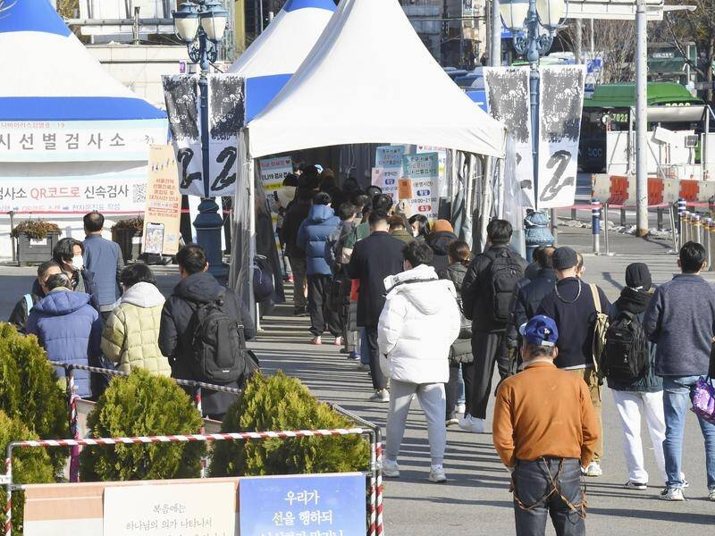 People queue for COVID tests in Seoul on the day S.Korea topped 4000 new cases for the first time.
