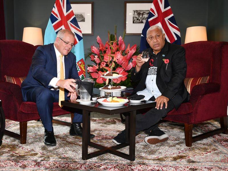 PM Scott Morrison (L) has agreed to allow imports of up to four kilograms of kava for personal use.
