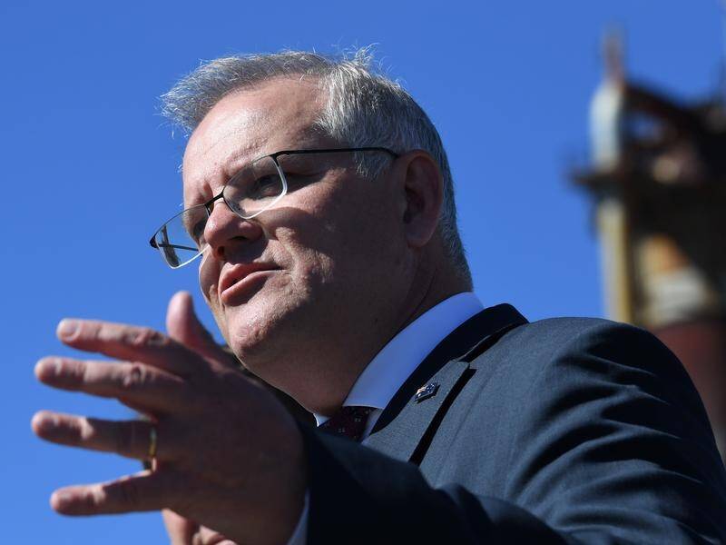 Prime Minister Scott Morrison is under pressure to set a timeline for opening Australia's border.