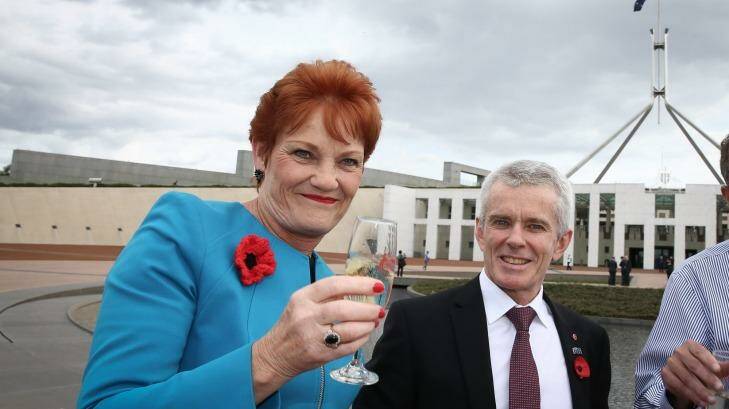 In Trumpier times ... Senator Pauline Hanson toasts Donald Trump's election victory with Senator Malcolm Roberts. Photo: Alex Ellinghausen