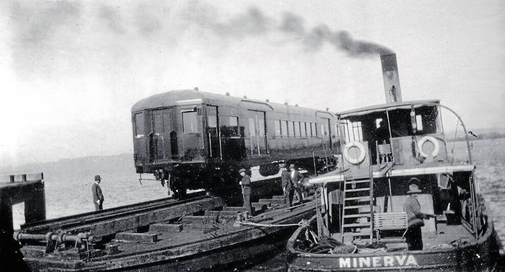 With the lack of a bridge connection from Walsh Island to the mainland the newly-built electric cars had to be transferred from a barge for ultimate loco-haulage to Sydney. This barge was propelled by the steam-powered tug S. S. Minerva. Credit: ARHS/NSW Rail Resource Centre