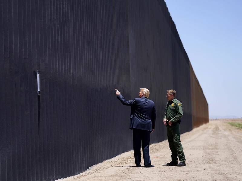 President Donald Trump has inspected the wall at the US-Mexico border in Arizona.