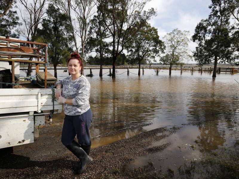 "We can't get out because our driveway is underwater," says the NSW Hunter region's Jodie McCosker.