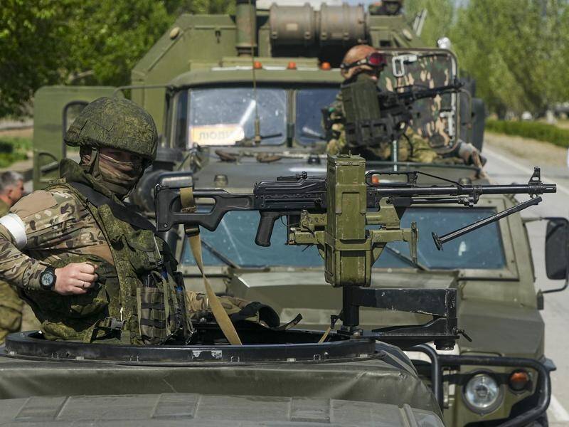 Armed Russian servicemen have captured territory in Ukraine's Zaporizhzhia region.