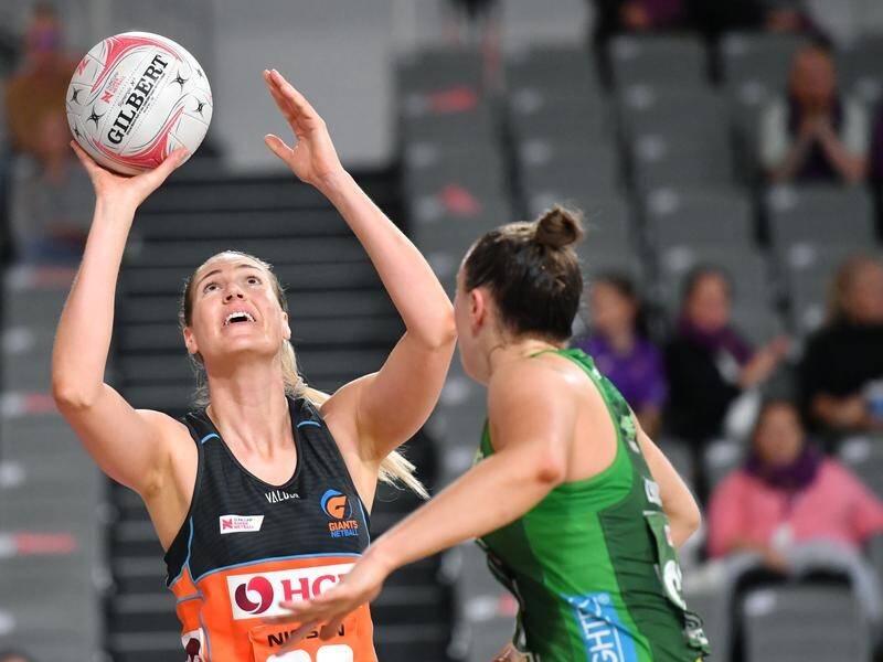 Giants' Caitlin Bassett has celebrated 200 Super Netball games with a victory over West Coast Fever.