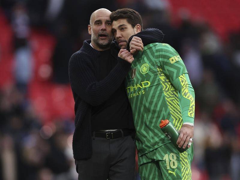 Pep Guardiola was indebted to substitute No.1 Stefan Ortega after his display against Spurs. (AP PHOTO)