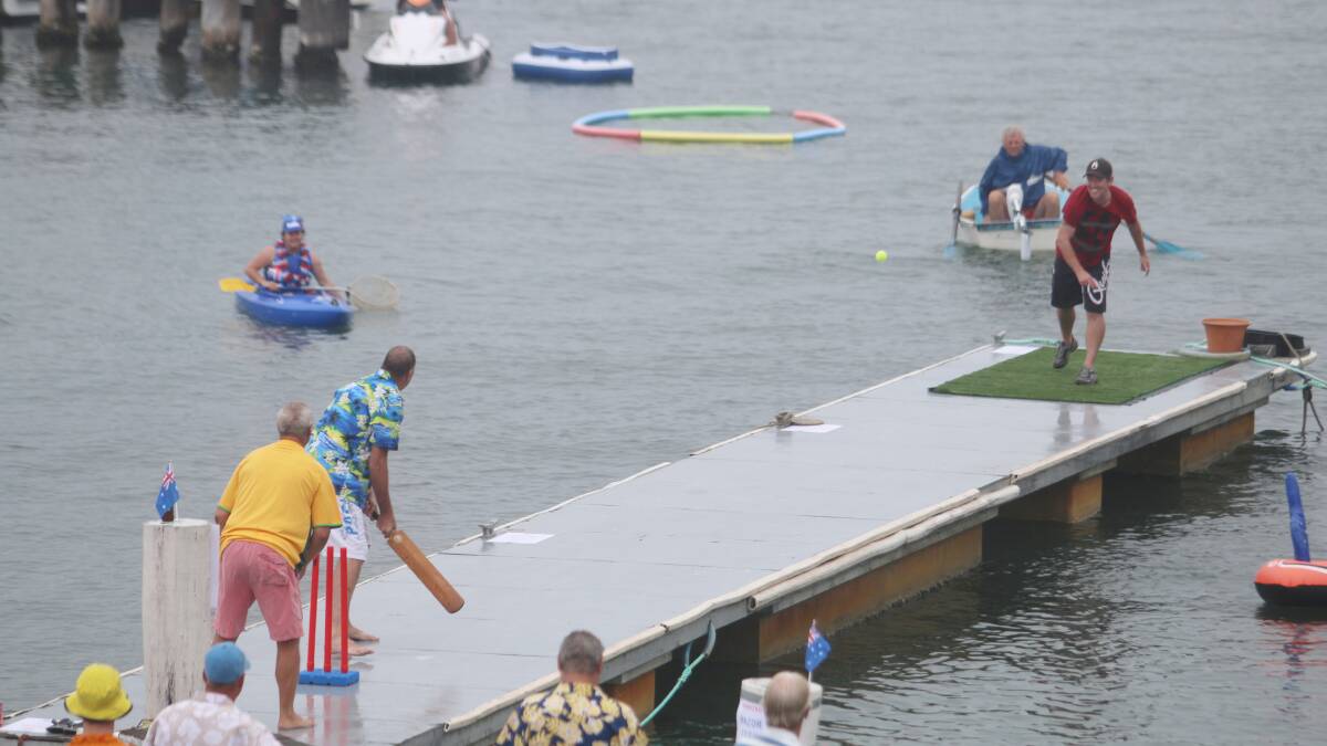 Pontoon cricket action from the Australia Day novelty game on Lake Macquarie, at Royal Motor Yacht Club, Toronto. Pictures: Jamieson Murphy