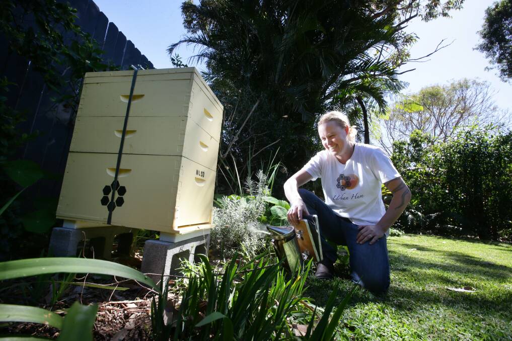 URBAN BUZZ: Kelly-Ann Lees, founder of Newcastle beekeeping project, Urban Hum, which is helping bring bees back to the city. Picture: Peter Stoop