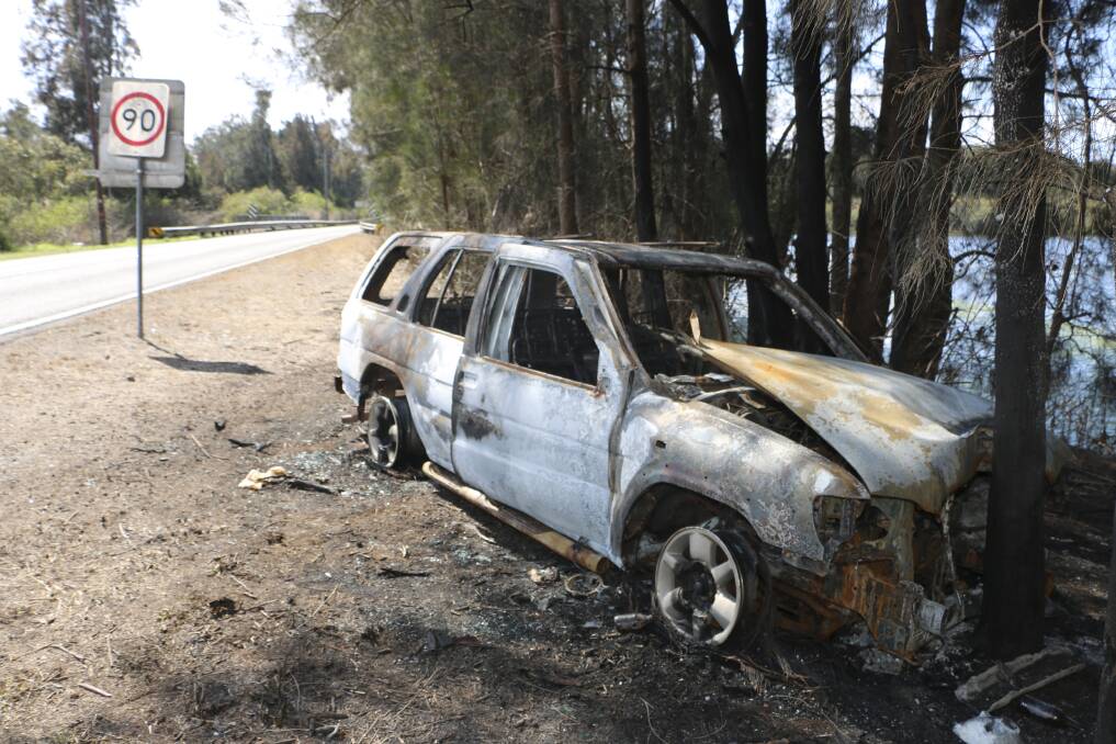 BURNT OUT: The remnants of the car near Muddy Lake on Monday. Picture: Jamieson Murphy.