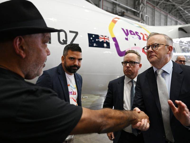 Noel Pearson, Dean Parkin, Alan Joyce and Anthony Albanese help launch the new Yes23 logo. (Dean Lewins/AAP PHOTOS)