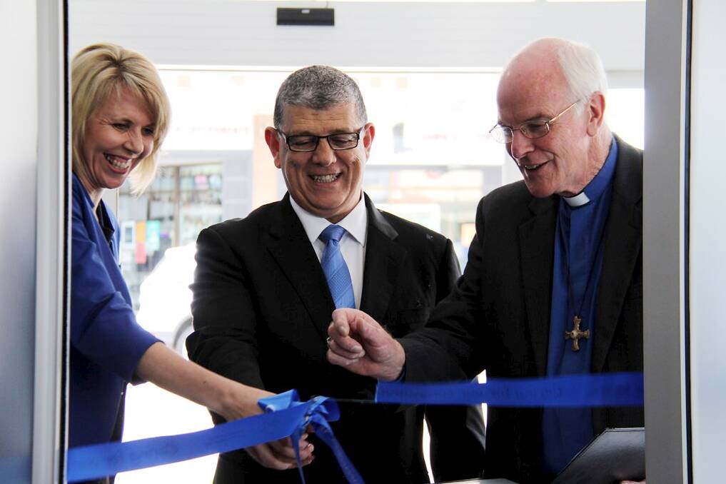 EXPANDING: Helga Smit, Minister for Disability Services John Ajaka and Bishop Bill Wright open the new office.